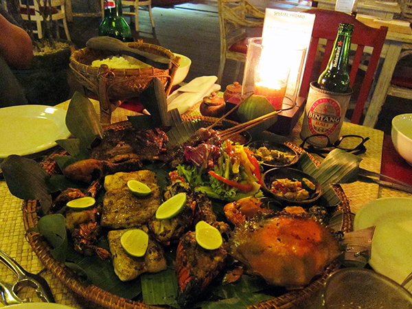 Seafood platter and beer.. Look at the impressive spread! Crab, prawns, snapper, squid, lobster, chicken satay and ribs! 